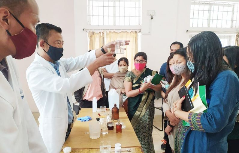 Staff under State Public Health Laboratory demonstrating various ways to check food adulterations in common food items sold in the market.